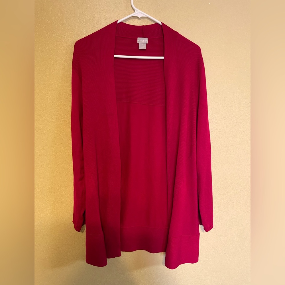 Chico’s size 1 (M) red cardigan. Longer style, falls below the hip.